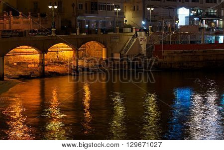 Sliema, MALTA - JAN 14, 2014: night view of coast in Sliema in Mediterranean sea Jan 14, 2014. Sliema by night