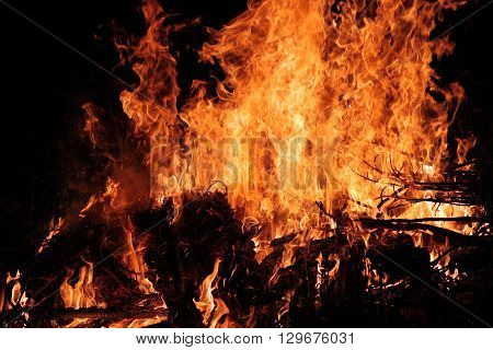 hot flame burning bonfire with firewood at night