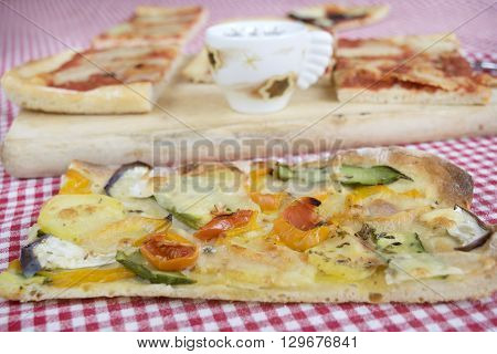 handcraft vegetarian pizza with near a cup of espresso coffee