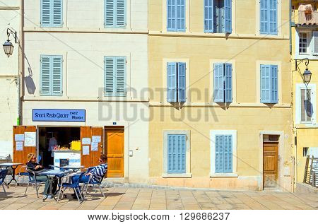 Marseille France - April 29 2006: People and traditional stores in the main square of the old district Le Panier