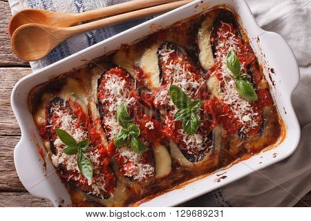 Italian Eggplant Baked With Cheese In Tomato Sauce Close Up In Baking Dish. Horizontal Top View