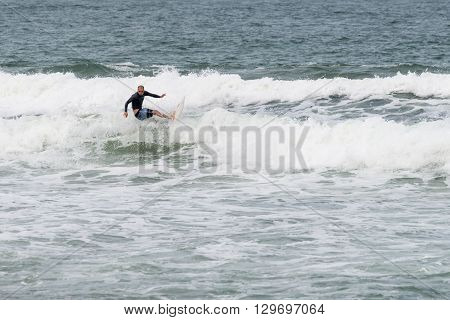Surfers In Action At The Brava Beach In Florianopolis,