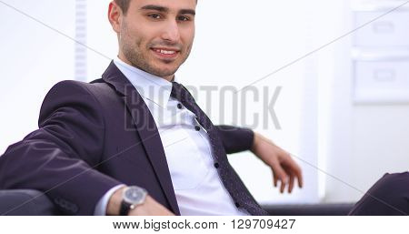 young businessman sitting in his office on sota