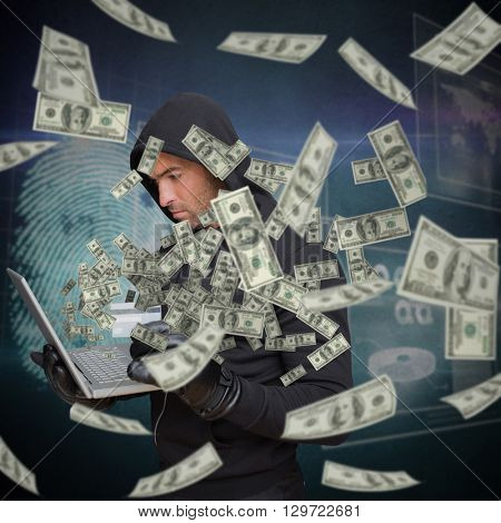 Hacker holding laptop and credir card against digital security finger print scan