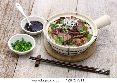 chinese sausage and chicken with rice in clay pot, cantonese food