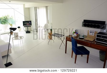 HERAKLION CRETE GREECE - MAY 13 2014: The Interior of light room with table and radio in modern building of luxury class hotel on the Mediterranean coast of Crete, May 13, 2014, Greece.