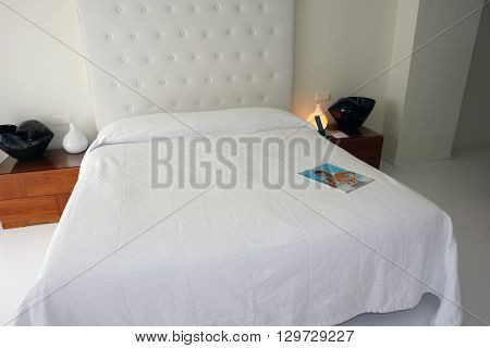 HERAKLION CRETE GREECE - MAY 13 2014: The Interior room with big white bed in modern building of luxury class hotel on the Mediterranean coast of Crete May 13 2014 Greece.
