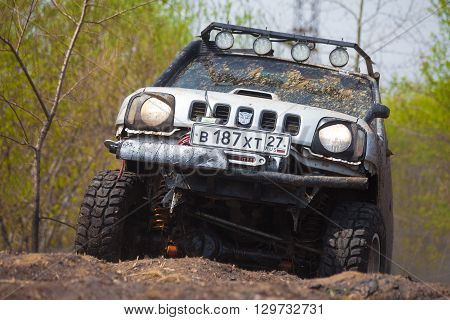 KHABAROVSK RUSSIA - MAY 14 2016: Suzuki Jimny cross country moving