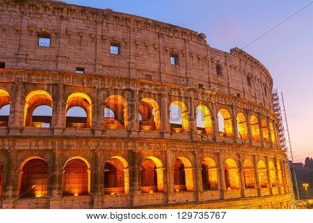 detail of Colosseum illuminated at night  in Rome, Italy, toned