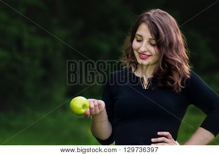 Beautiful Girl Holding A Green Apple