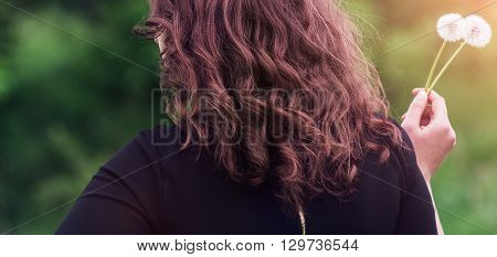 Girl With A Dandelion In The Hand