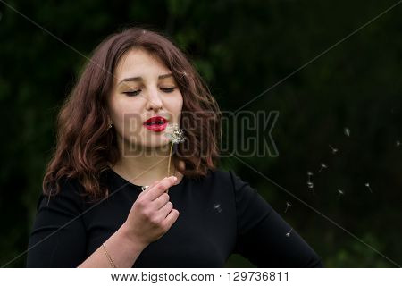 Girl With A Dandelion In The Hand