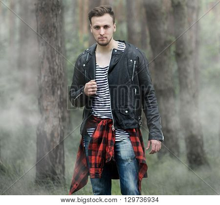 Man Standing In The Misty Forest.