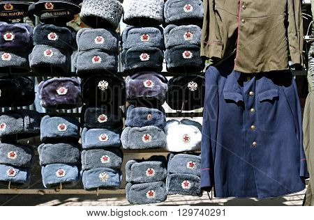 MOSCOW, RUSSIA - MAY 7, 2016: Many multi-colored military hats Soviet and Russian army and navy and outdated military uniform