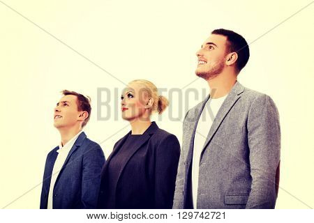 Business people standing and looking away together