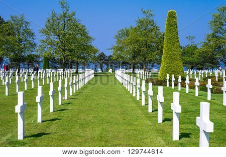 Colleville Sur Mer France - May 23 2012: Normandy visitors walking in the American Cemetery of the second World War.
