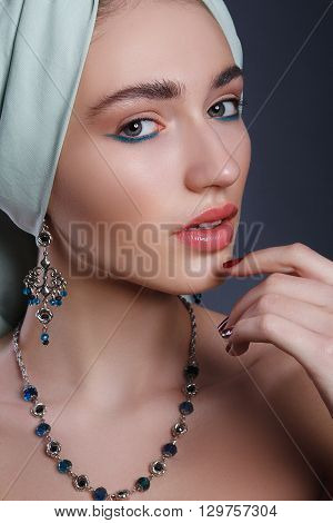Eastern stylish model girl with a turban on his head. Jewels