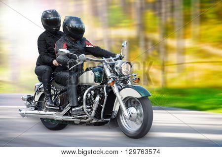 Dynamic and realistic motorbike racing on bright summer background