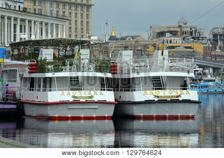 KIEV,UKRAINE - MAY 15, 2016: Pleasure boats on the Dnepr River and river shore in historical area. Kiev. Ukraine