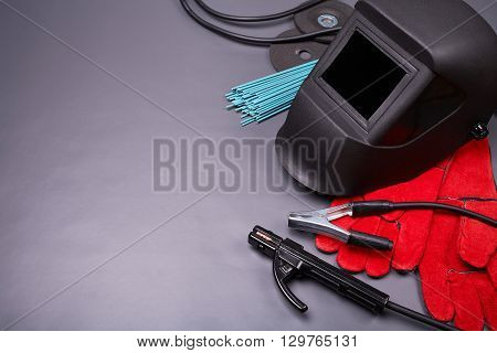 Welding equipment, welding mask, protective leather gloves, welding electrodes, high-voltage wires with clamps, cutting disc for grinder, set of accessories for arc welding.