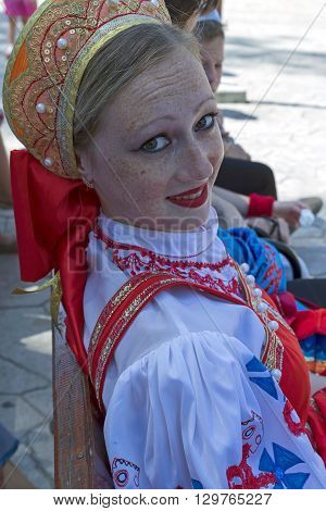 ROMANIA TIMISOARA - JULY 12 2015: Unidentified young Ukrainian girl in traditional costume present at a international folk dance festivalduring " International Festival of hearts "