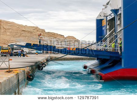 Santorini, Greece - May 2, 2016: The big sea ferry is moored off in the port of Athinios on the island of Santorini. Sea ferries make regular flights between the Greek islands.