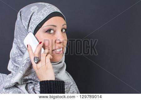 Muslim Woman In Hijab Holding A Mobile Phone