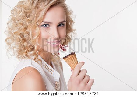 Close-up Portrait of young curly women with ice-cream isolated on white background. Copyspace