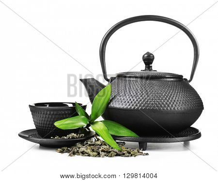 Green tea with black utensils, isolated on white