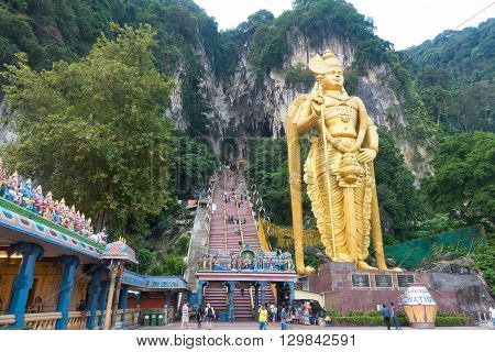 KUALA LUMPUR MALAYSIA - MAY 9 2016: Hindu devotees walk up the Sri Mahamarriamman temple built inside a limestone cave. Hundreds of thousands of devotees gather here for the Thaipusam prayers.