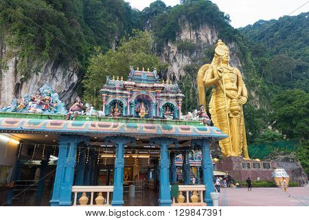 KUALA LUMPUR MALAYSIA - MAY 9 2016: Hindu devotees walk up the Sri Mahamarriamman temple built inside a limestone cave. Hundreds of thousands of devotees gather here for the Thaipusam prayers.