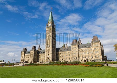OTTAWA CANADA - 11TH OCTOBER 2014: The houses of parliament in Ottawa from the distance. People can be seen outside