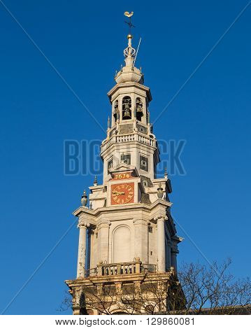 Closeup to the Clock Tower on Zuiderkerk Church in Amsterdam during the day.