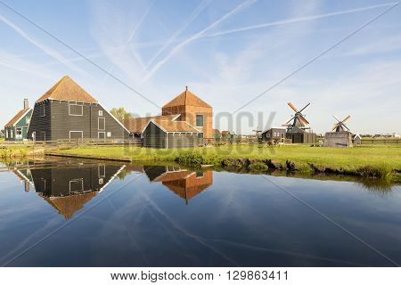 Traditional Dutch windmills with canal in Zaanse Schans at Amsterdam Netherland