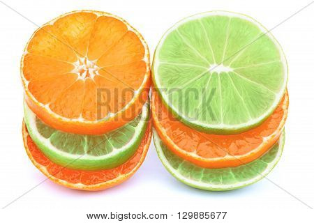 Stack of tangerines and limes slices isolated on the white background with clipping path