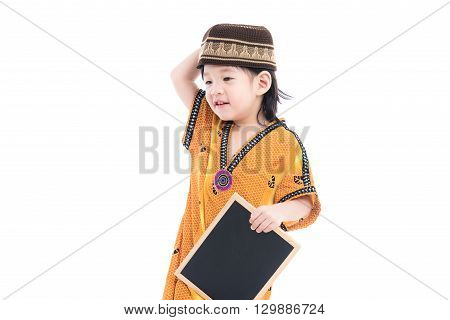 Close up of cute muslim boy on white background isolated.