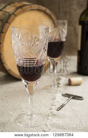 Old octave and two wineglasses are on sacking