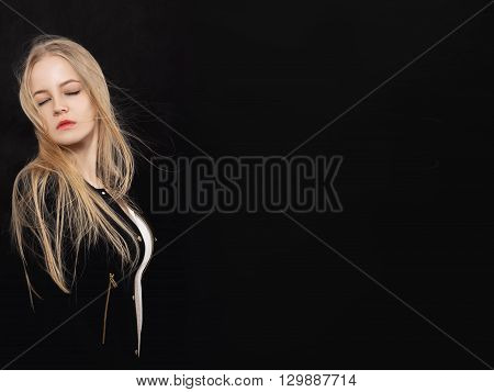 sensual blond girl on black background with copyspace