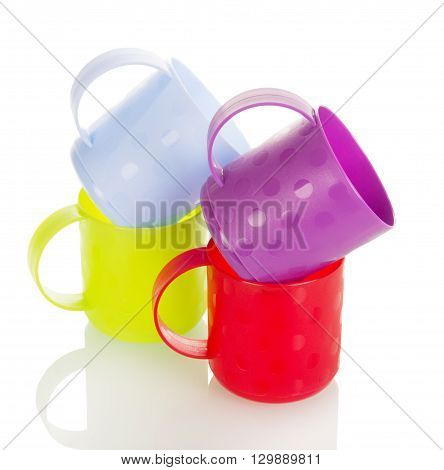 Colorful plastic cups isolated on white background.