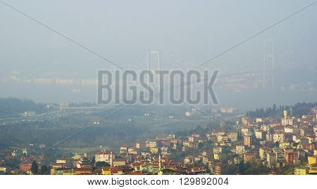 Istanbul Turkey - January 5 2014: In the morning due to heavy fog suddenly collapsed and continues to impact ferry in time delays have been experienced.Istanbul Bosphorus Bridge foggy view.