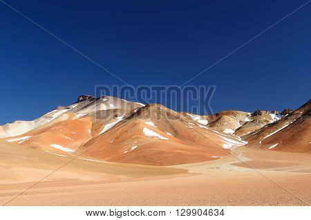 South America - the most beautifull Andes in Bolivia. The surreal landscape is nearly treeless punctuated by gentle hills and volcanoes near Chilean border