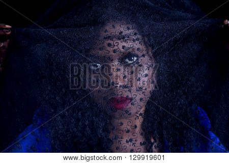 Portrait Of Young African American Female With A Black Veil On His Head