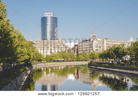 Bucharest, ROMANIA - April 22 2016: View of Dambovita river and BCR tower in Izvor area, near the Parliament building. BUCHAREST -April 22 2016