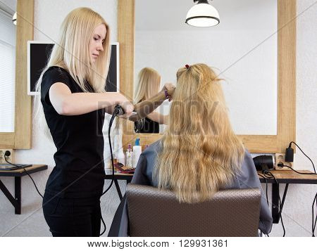 Barber Straightening Client's  Hair