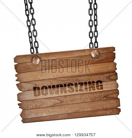 downsizing, 3D rendering, wooden board on a grunge chain