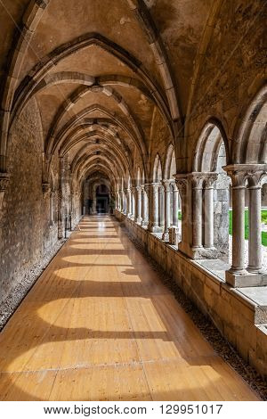 Santarem, Portugal. September 10, 2015: Cloister corridors of the Sao Francisco Convent. 13th century Mendicant Gothic Architecture. Franciscan Religious Order.