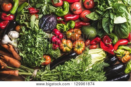 Variety of resh raw vegetable ingredients for healthy cooking or salad making, top view. Diet or vegetarian food concept, horizontal composition
