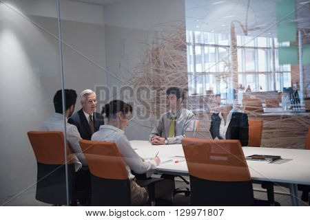 business people group brainstorming on meeting and businessman presenting ideas and projects oon laptop and tablet computer