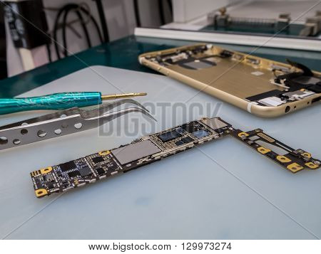 Repairing Smart Phone on Desk Selective Focus