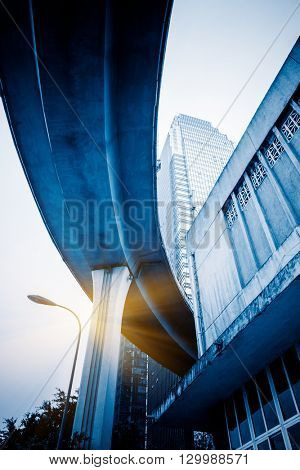 low angle view of chongqing interchange and skyscraper